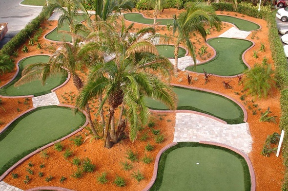 Los Angeles and Southern California Aerial view of a mini golf course with synthetic grass and palm trees.